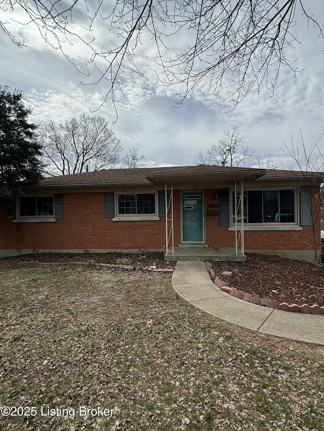 ranch-style house with brick siding