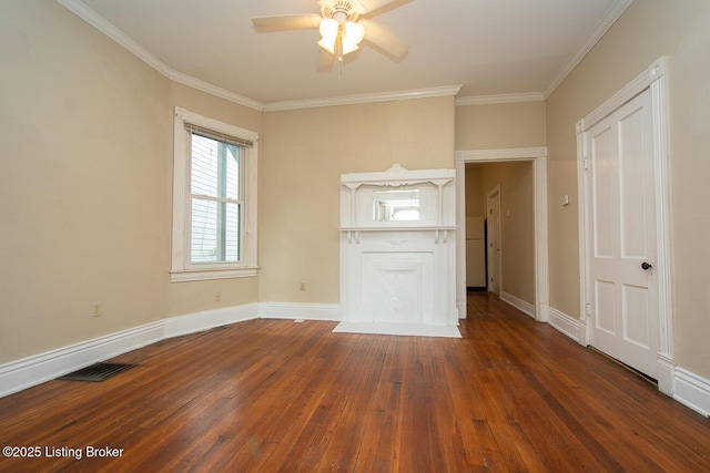 interior space featuring baseboards, visible vents, dark wood-type flooring, and ornamental molding