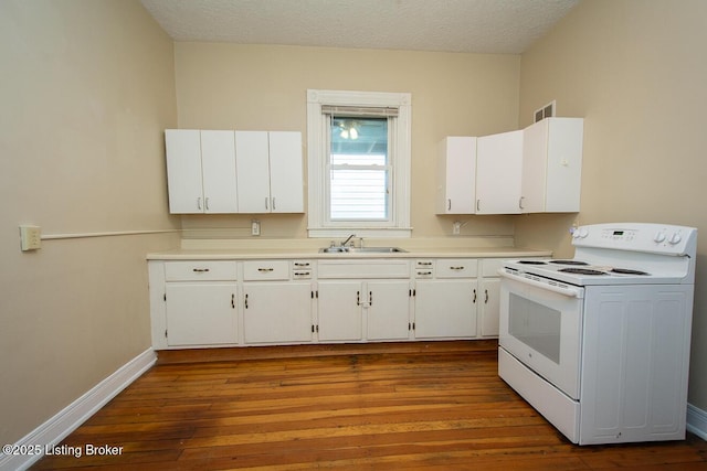 kitchen featuring a sink, white cabinetry, light wood-style floors, light countertops, and white range with electric cooktop