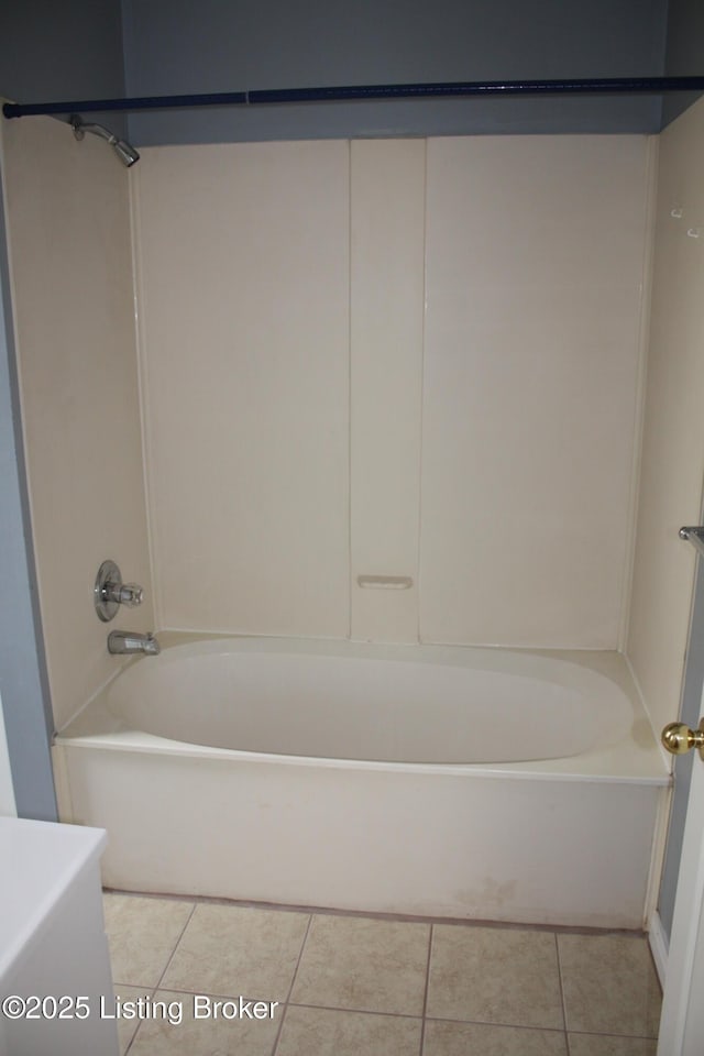 bathroom featuring shower / bathing tub combination and tile patterned flooring