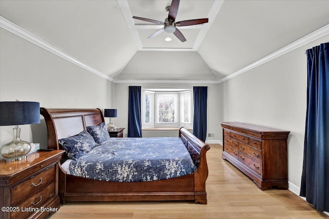 bedroom featuring ornamental molding, vaulted ceiling, baseboards, and wood finished floors