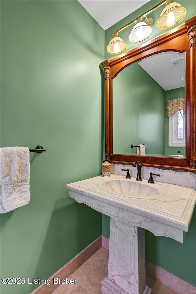 bathroom featuring tile patterned floors, visible vents, and baseboards