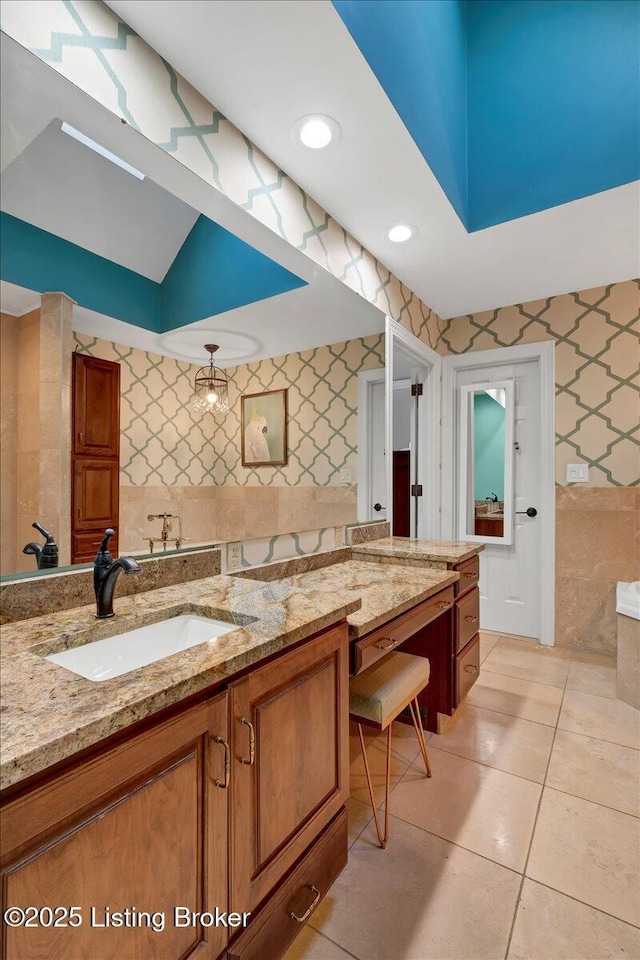 full bathroom featuring wallpapered walls, tile patterned floors, vanity, tile walls, and recessed lighting