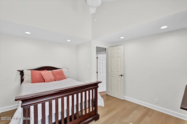 bedroom featuring recessed lighting, wood finished floors, and baseboards