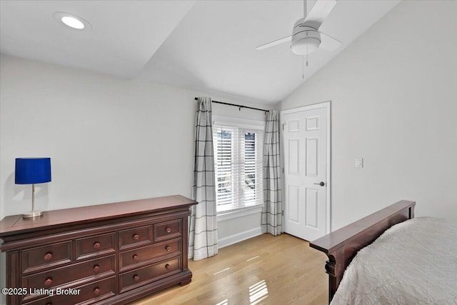 bedroom featuring lofted ceiling, recessed lighting, light wood-style flooring, a ceiling fan, and baseboards