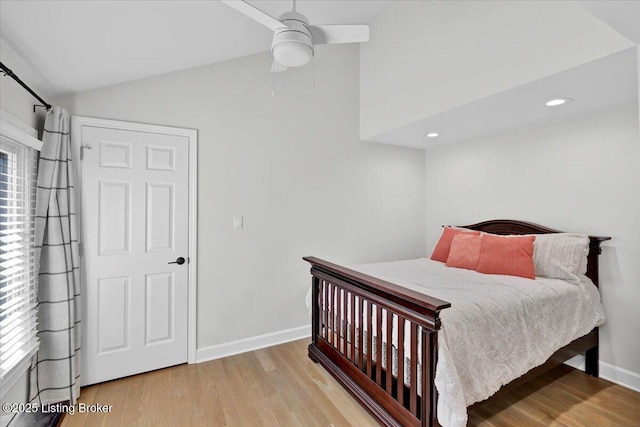 bedroom with baseboards, lofted ceiling, ceiling fan, wood finished floors, and recessed lighting