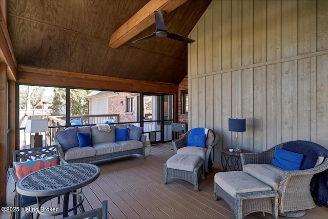 wooden terrace with a ceiling fan and outdoor lounge area