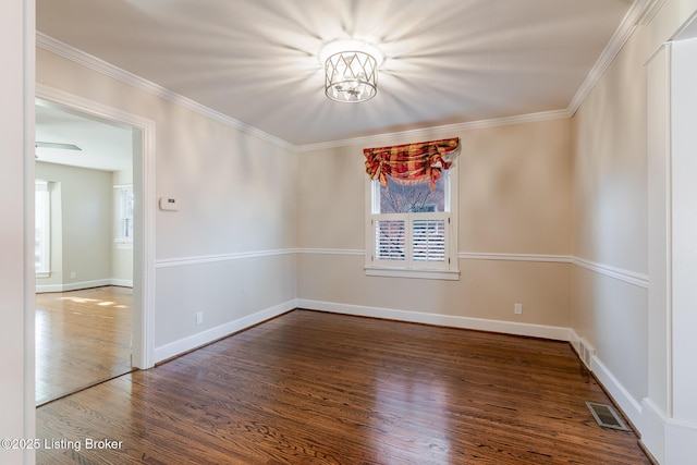 unfurnished room with ornamental molding, dark wood-type flooring, and a wealth of natural light