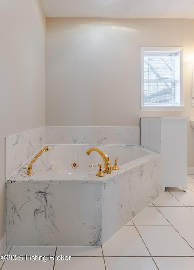 full bath featuring a garden tub and tile patterned floors