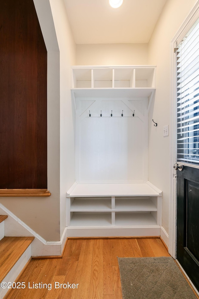 mudroom featuring light wood-type flooring and baseboards