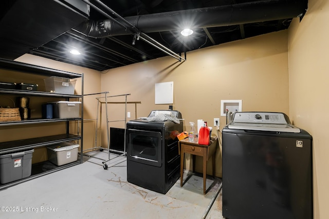 clothes washing area featuring laundry area and separate washer and dryer