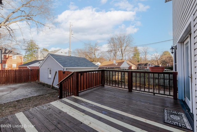 wooden deck featuring a residential view and fence