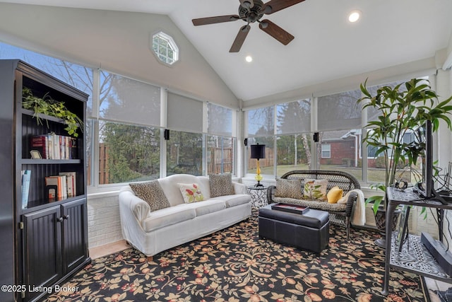 sunroom featuring lofted ceiling and ceiling fan