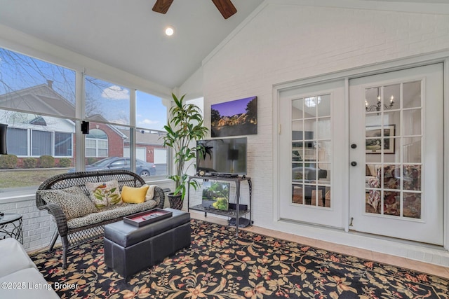 sunroom featuring vaulted ceiling and ceiling fan