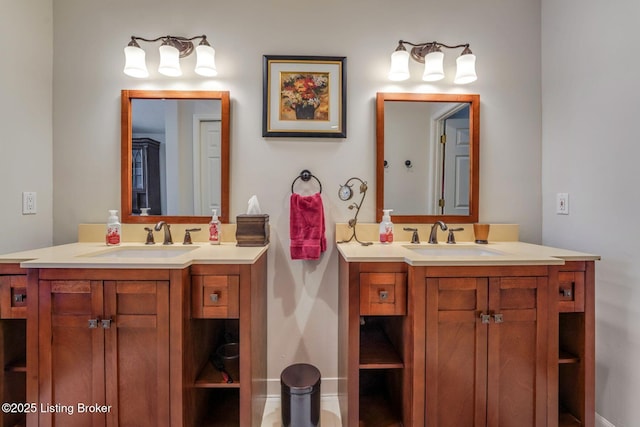 bathroom with two vanities and a sink