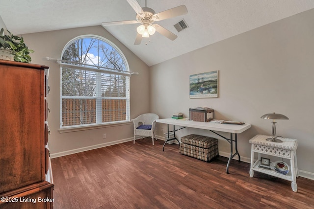 sitting room featuring ceiling fan, wood finished floors, visible vents, baseboards, and vaulted ceiling