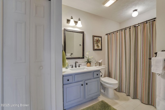 full bathroom with a shower with shower curtain, toilet, tile patterned flooring, a textured ceiling, and vanity