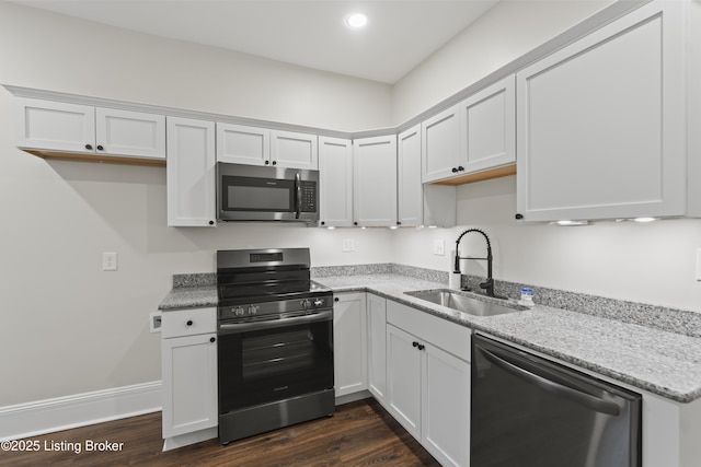 kitchen featuring white cabinets, stainless steel appliances, and a sink