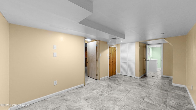 unfurnished room featuring visible vents and baseboards