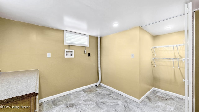 laundry area with hookup for a washing machine, laundry area, and baseboards