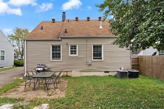 back of house with a patio, central AC, fence, a yard, and crawl space