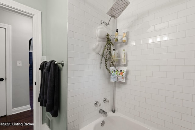 full bath with tub / shower combination and visible vents