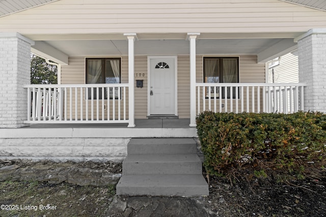 doorway to property with covered porch