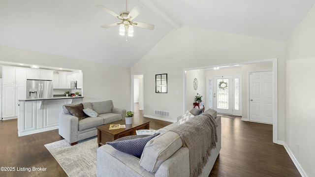 living area with dark wood-style floors, visible vents, high vaulted ceiling, beamed ceiling, and baseboards