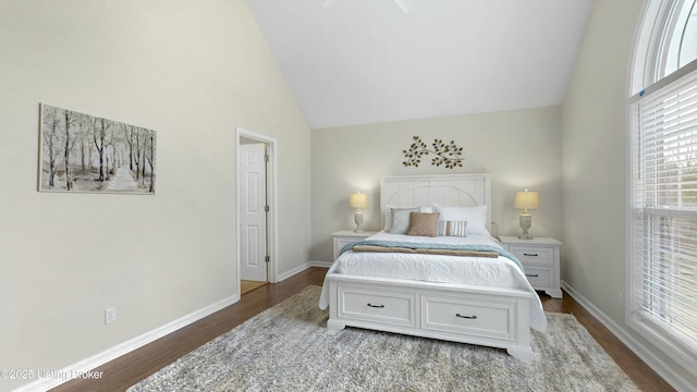 bedroom featuring dark wood-type flooring, high vaulted ceiling, and baseboards