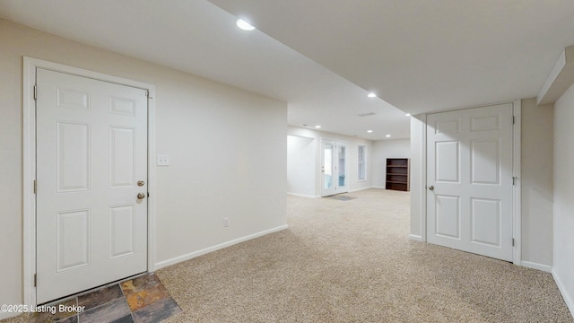 basement with carpet floors, recessed lighting, and baseboards