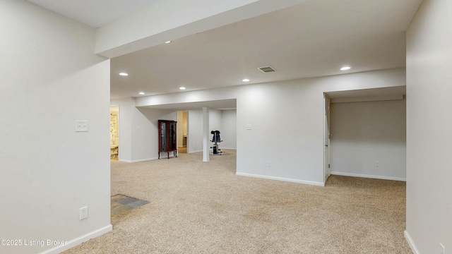 finished basement featuring carpet, visible vents, baseboards, and recessed lighting