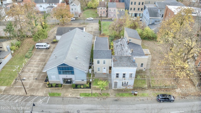 birds eye view of property with a residential view