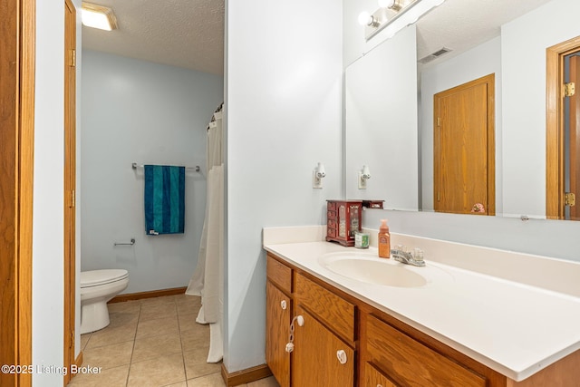 bathroom with visible vents, toilet, tile patterned floors, a textured ceiling, and vanity