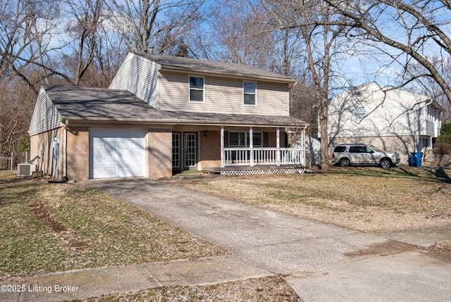 view of front of home with a garage, brick siding, aphalt driveway, covered porch, and a front yard