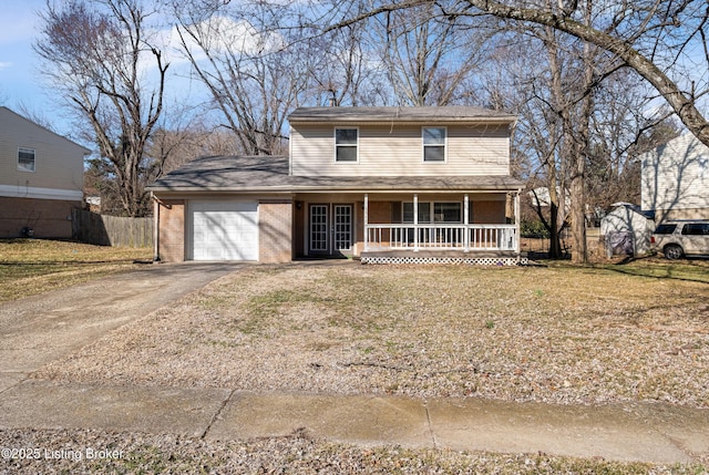 traditional home featuring aphalt driveway, brick siding, covered porch, fence, and a garage