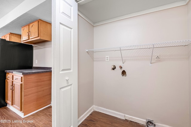 laundry room featuring hookup for a washing machine, laundry area, baseboards, dark wood-style floors, and electric dryer hookup