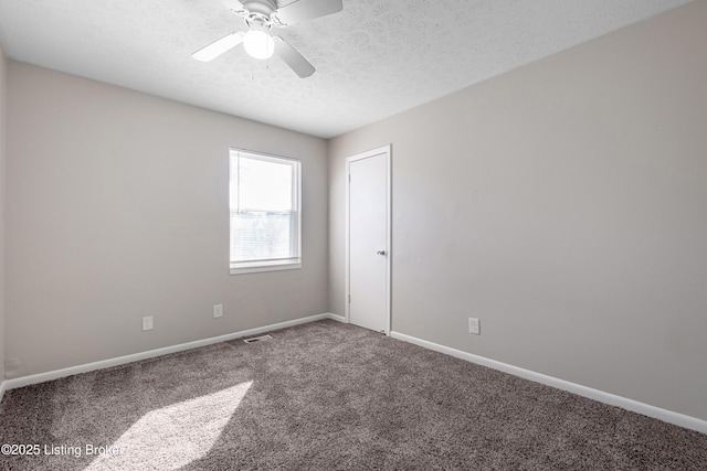 spare room featuring ceiling fan, baseboards, a textured ceiling, and carpet flooring