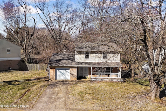 view of front of house with a garage, a front yard, covered porch, and concrete driveway