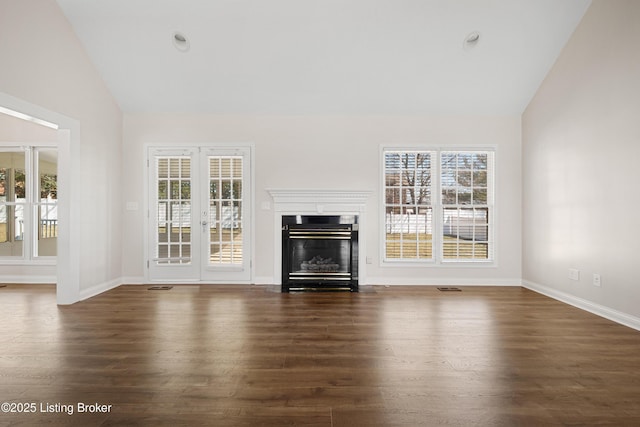 1523 Yorkshire Dr, Elizabethtown, KY 42701 - unfurnished living room with plenty of natural light, vaulted ceiling, and a fireplace with flush hearth