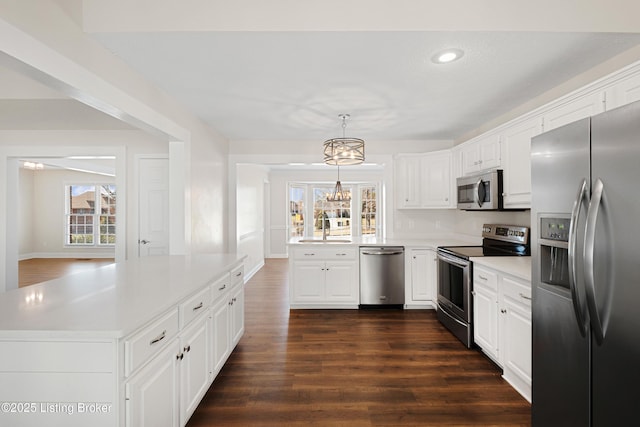 1523 Yorkshire Dr, Elizabethtown, KY 42701 - kitchen featuring a sink, white cabinetry, light countertops, appliances with stainless steel finishes, and dark wood finished floors