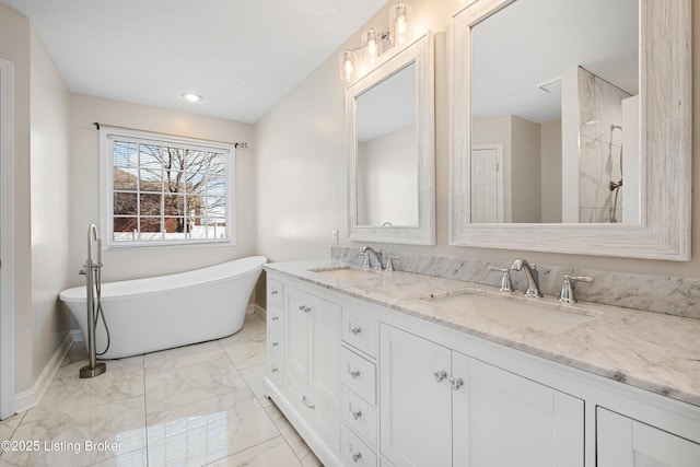 1523 Yorkshire Dr, Elizabethtown, KY 42701 - bathroom featuring double vanity, marble finish floor, a freestanding bath, and a sink
