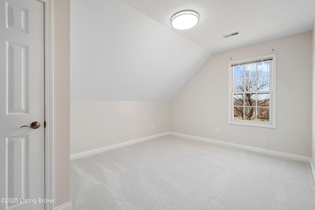 1523 Yorkshire Dr, Elizabethtown, KY 42701 - bonus room with lofted ceiling, visible vents, light carpet, and baseboards