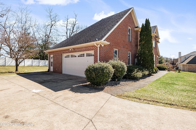 1523 Yorkshire Dr, Elizabethtown, KY 42701 - view of side of property featuring driveway, an attached garage, fence, a yard, and brick siding