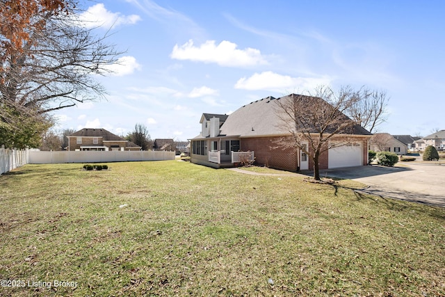 1523 Yorkshire Dr, Elizabethtown, KY 42701 - view of home's exterior with brick siding, concrete driveway, a sunroom, fence, and a garage