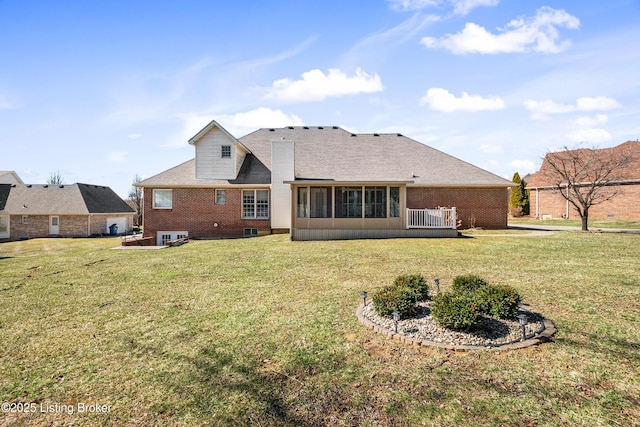 1523 Yorkshire Dr, Elizabethtown, KY 42701 - back of property with a sunroom, a lawn, and brick siding