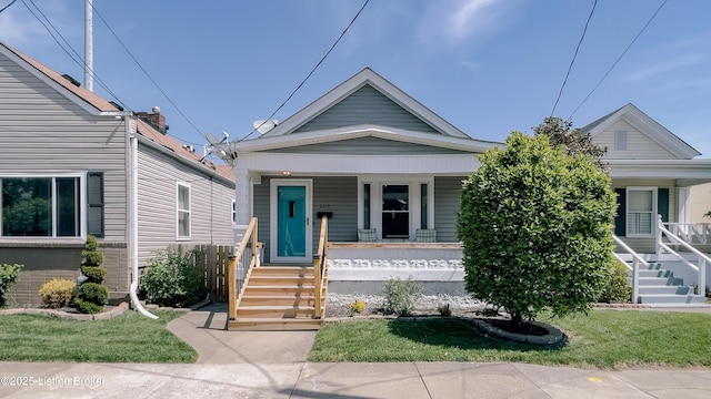 shotgun-style home featuring a porch