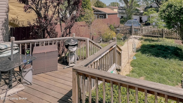 wooden deck featuring fence and grilling area