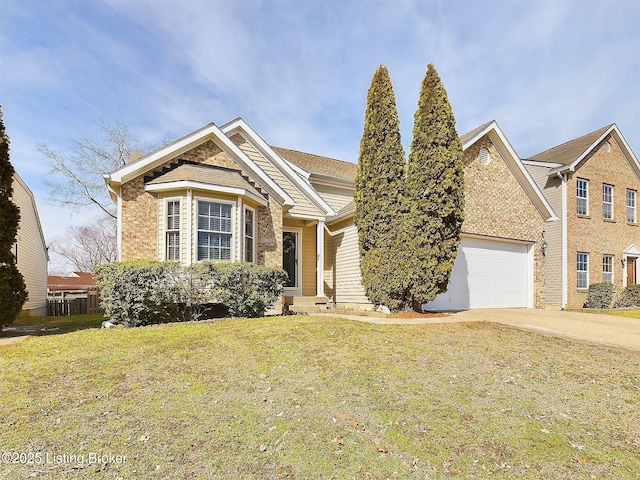 view of front of property featuring a front yard, concrete driveway, brick siding, and an attached garage