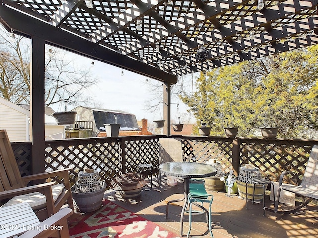 exterior space featuring a pergola and outdoor dining space