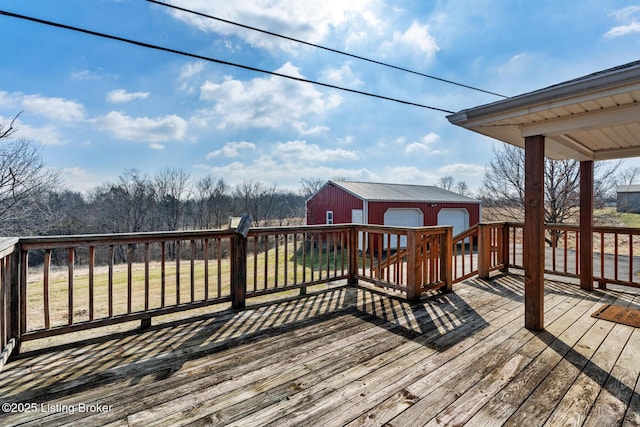 deck featuring a garage and an outdoor structure